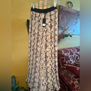 Animal print pleaded pant with elastic in waist, wide legs. Size large.